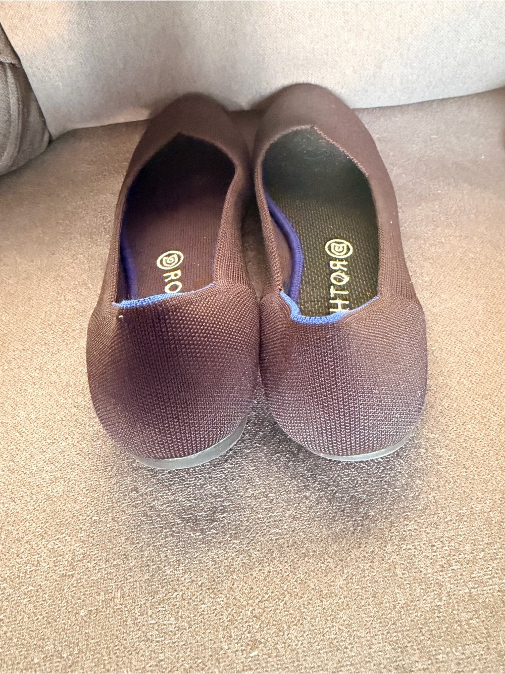 Rothy's Dark Black Knit Slip-On Flats with Blue Accent